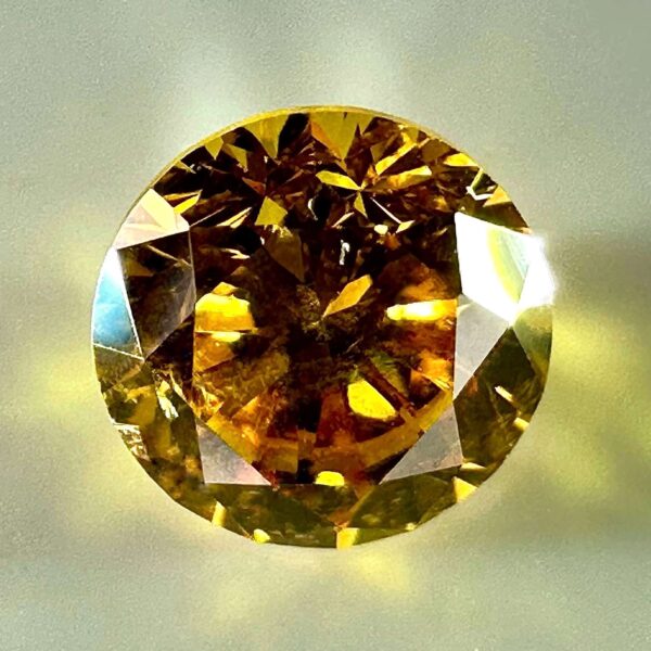 0.30 carat natural orange-yellow diamond with SI2 clarity and vibrant luster, perfect for jewelry or collection.