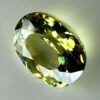 0.46 carat natural demantoid garnet from Namibia, bright green color, eye-clean clarity, and exceptional brilliance.