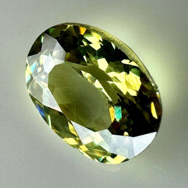 0.46 carat natural demantoid garnet from Namibia, bright green color, eye-clean clarity, and exceptional brilliance.