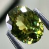 0.46 carat natural demantoid garnet from Namibia, bright green color, eye-clean clarity, and exceptional brilliance.