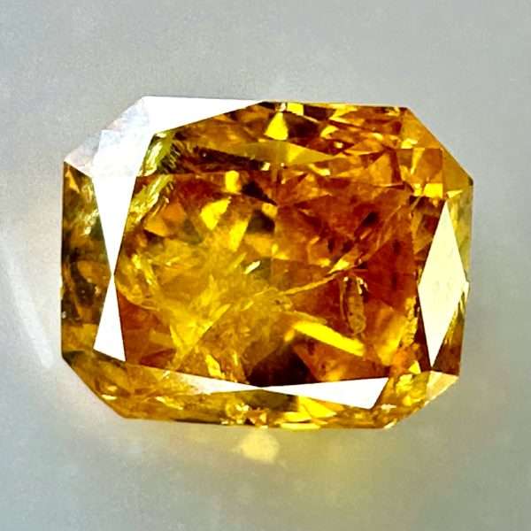 0.54ct Natural Orange-Yellow Diamond, Fancy Intense, Radiant Shape, with I2 Clarity, Perfect for Unique Jewelry Creations.