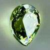 0.43 carat natural demantoid garnet from Namibia, bright green color, and excellent clarity.