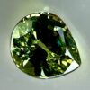 0.43 carat natural demantoid garnet from Namibia, bright green color, and excellent clarity.
