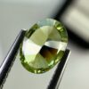 0.40 carat natural demantoid garnet from Namibia, very bright green color, oval cut, and untreated.