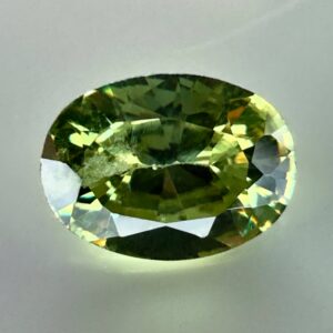 0.40 carat natural demantoid garnet from Namibia, very bright green color, oval cut, and untreated.