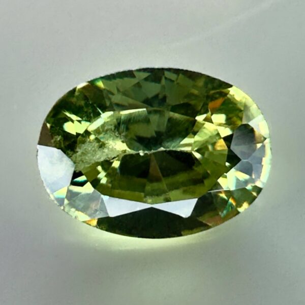 0.40 carat natural demantoid garnet from Namibia, very bright green color, oval cut, and untreated.