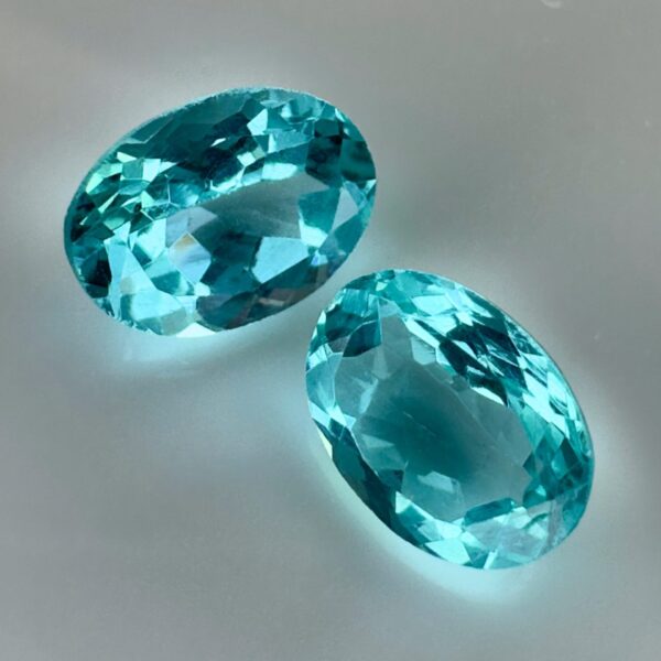 Pair of 1.99 carat blue Paraiba-type apatites, oval cut, vibrant turquoise blue and brilliant appearance.