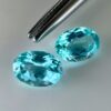 Pair of 1.99 carat blue Paraiba-type apatites, oval cut, vibrant turquoise blue and brilliant appearance.