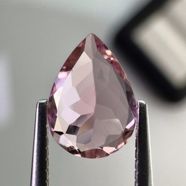 Pink tourmaline gemstone, 0.58 carat, pear-shaped cut, rare salmon pink color, beautiful clarity, and brilliant shine.